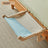 Wooden cat hammock bed hanging on a window