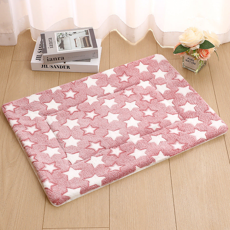 Dog lying on a blue starry sky flannel mat