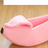 Playful fruit-shaped pet bed with curved sides, further angle view
