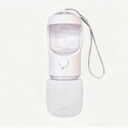 Portable pet drinking cup with food compartment, in use with a pet