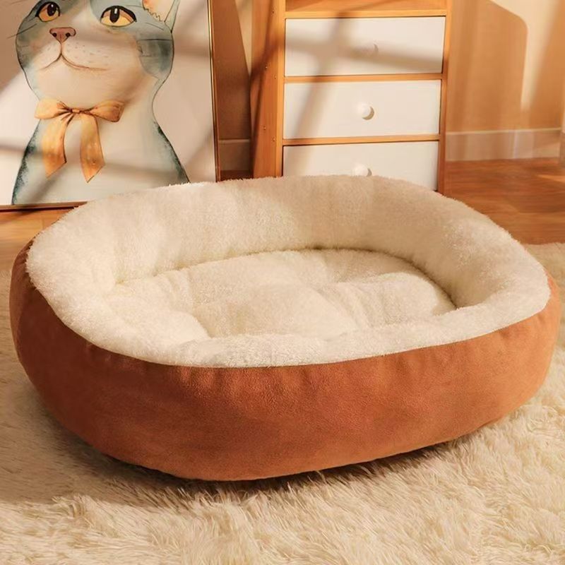 Cat lying in a pink wool blend oval pet bed