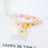 Floral cat collar with bell and safety buckle in Pink, side view