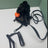Cat dressed as a headless horseman with a pumpkin lantern