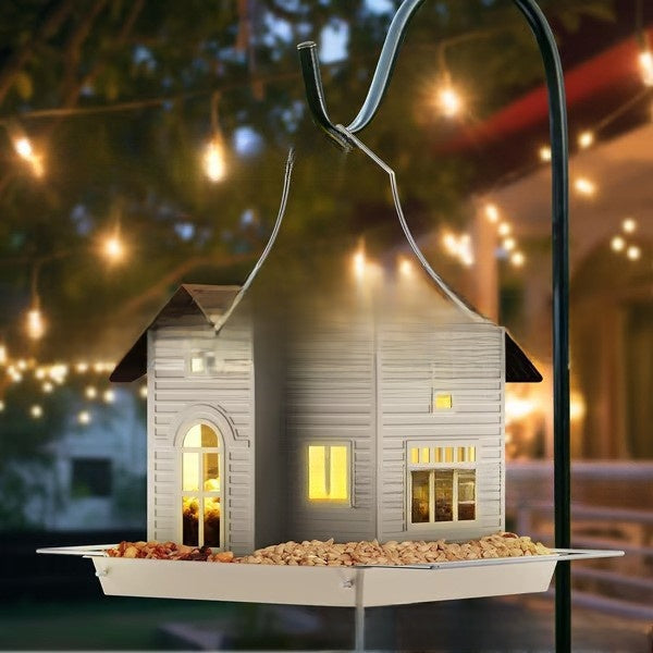 Metal swing garden bird feeder hanging outdoors, view 1