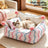 Semi-enclosed sofa style cat bed with striped poodle print, product image 1