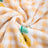 Cat curled up on a planet cat print pet blanket
