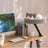 Light grey floating desktop cat bed on black wooden stand, photo 4