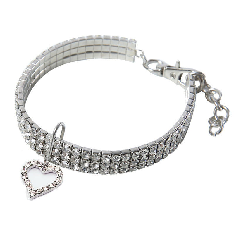 Rhinestone elastic pet collar with charm in Lake Blue Paw, in use with a pet