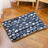 Dog lying on a blue starry sky flannel mat