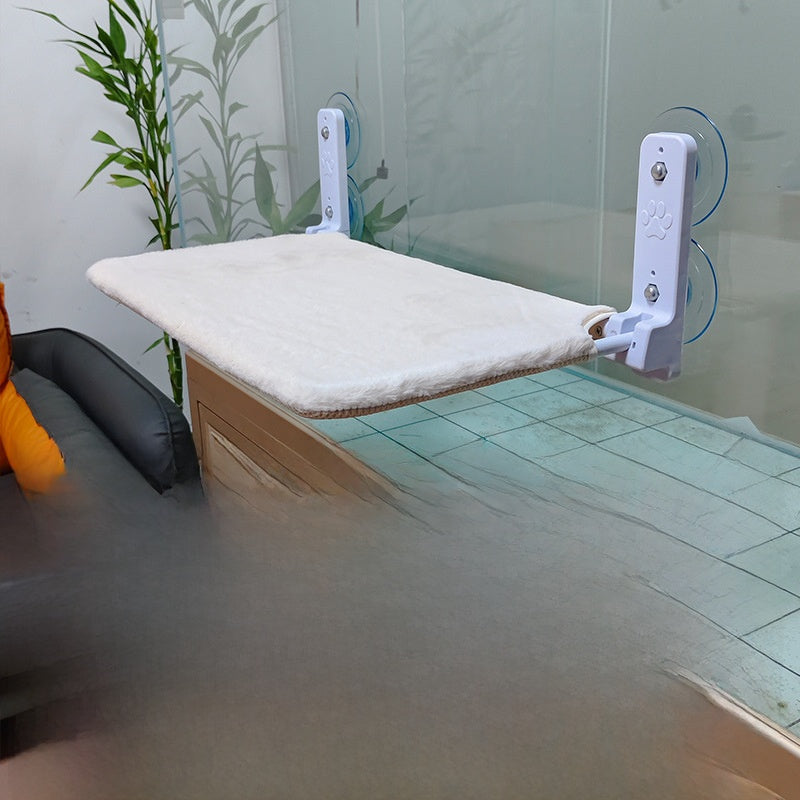 Hanging window cat bed attached with suction cups