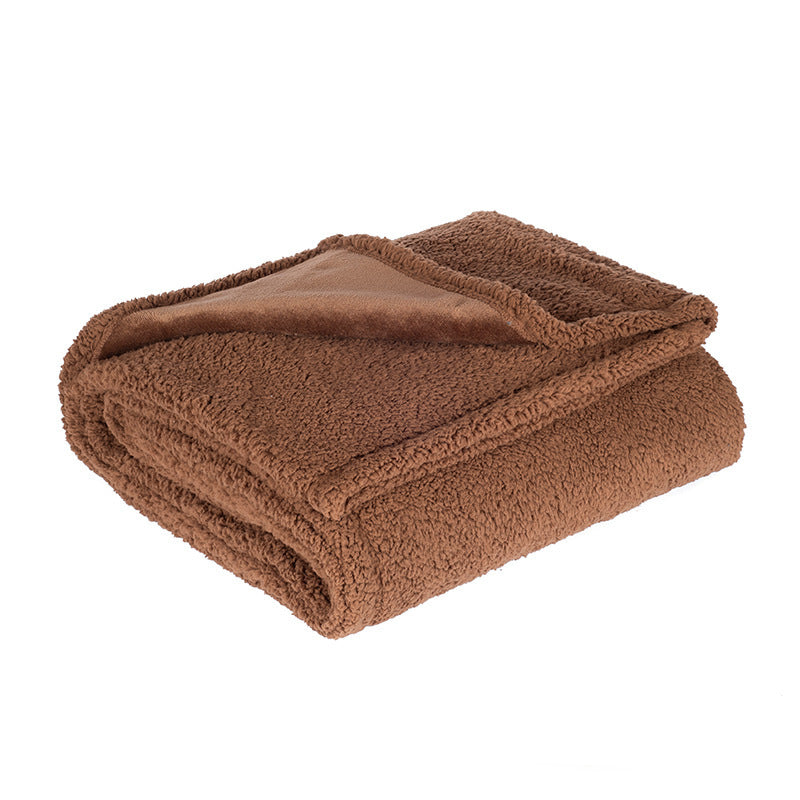 Waterproof double-sided pet blanket in grey on a sofa