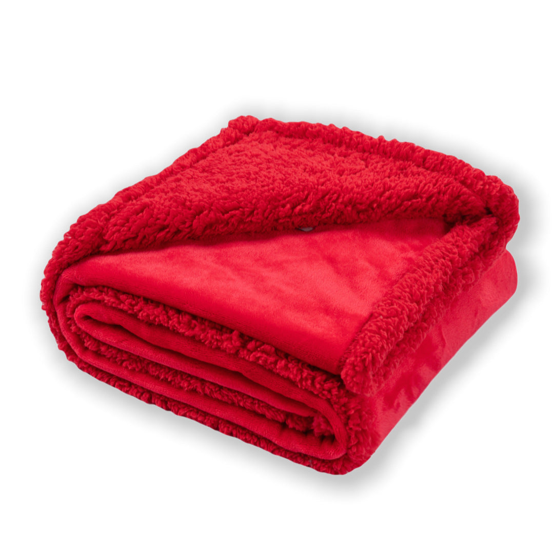 Dog lying on a beige flannel and fleece waterproof throw