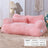 Cat curled up in a sunset orange sofa bed