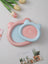 Shallow ceramic pet food plate with cute bear design in blue and pink, view 4