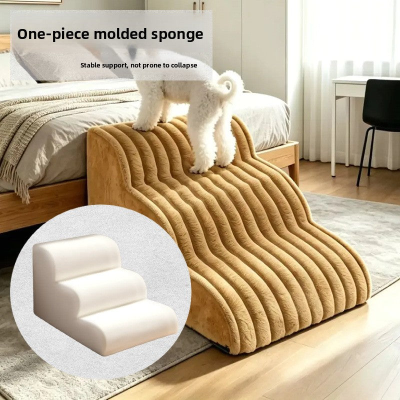 Small dog climbing off white washable dog stairs