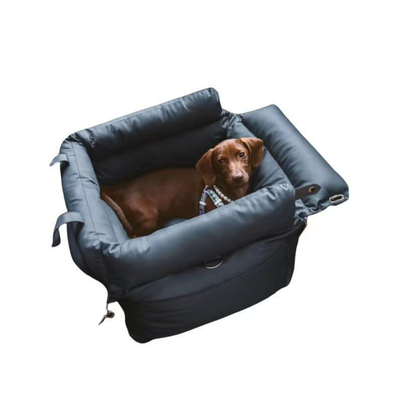 Small dog travelling in a black portable car seat bed
