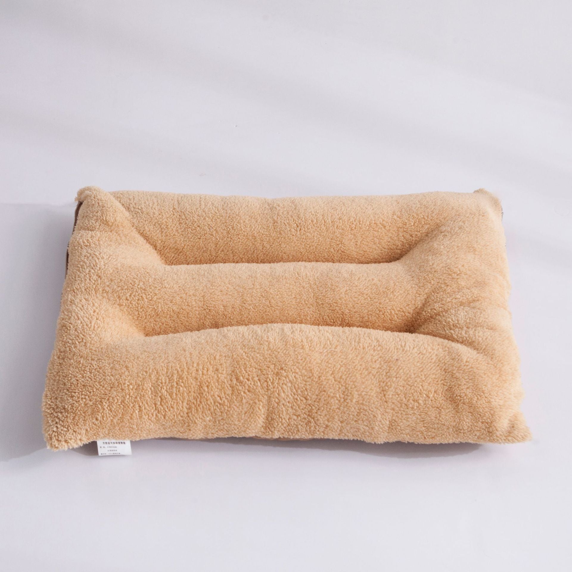 Dog resting on a washable flat bed mat