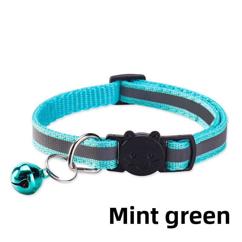 Striped reflective cat collar with bell, close-up detail view