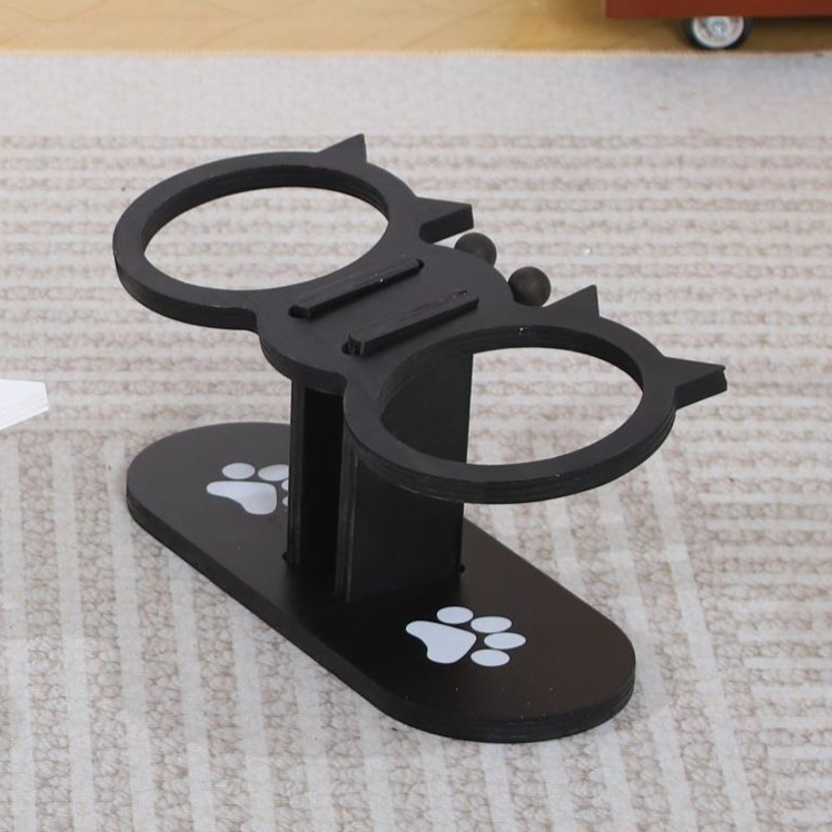 Cat eating from a white wooden feeder stand