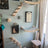 Four-step wooden cat climbing ladder on a wall