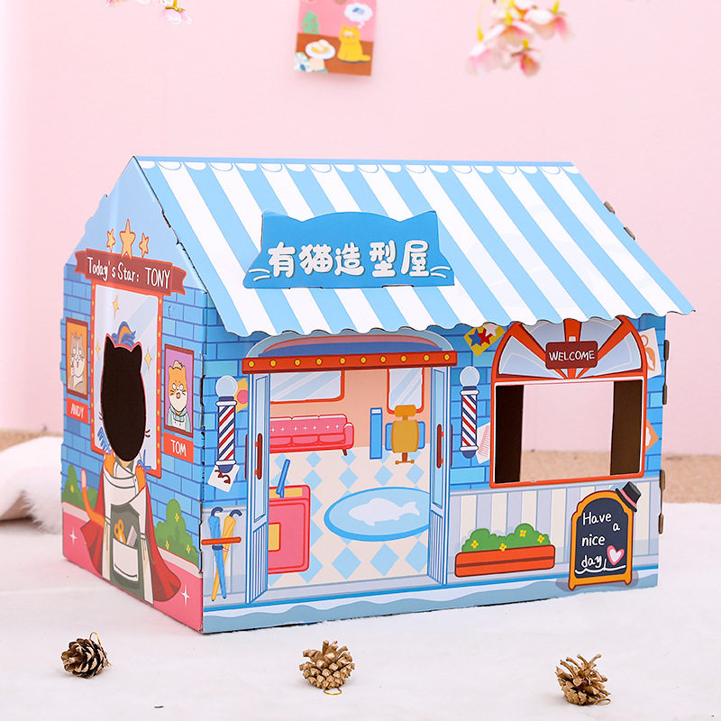 Cardboard cat scratcher house with a cafe themed design