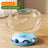 Clear capsule cat bed in transparent plastic with cream base, view 7