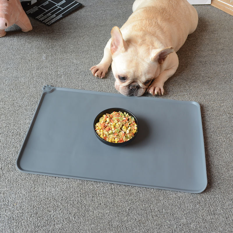 Royal blue non-slip food mat under a dog bowl