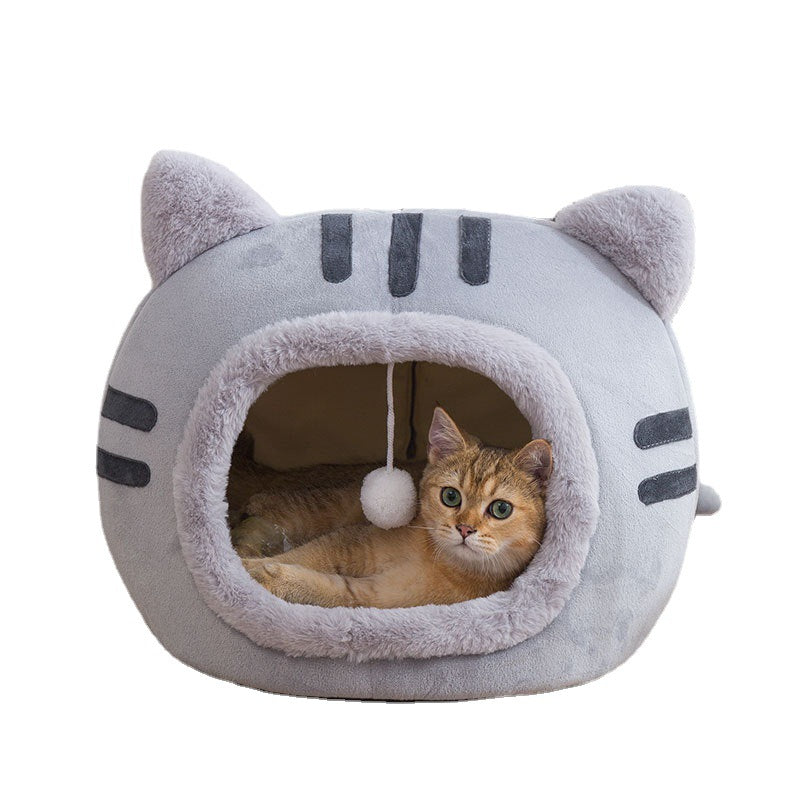 Cat sleeping in a curry coloured cat head bed
