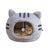 Cat sleeping in a curry coloured cat head bed