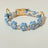 Handmade woven boho pet collar with pearl flowers in Rose Red, front view