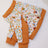 Elbow protection dog pyjamas for large dogs in Christmas Puppy, side view