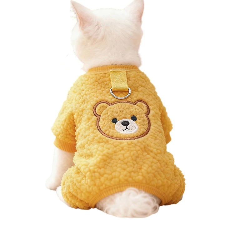 Small dog wearing a cosy blue sherpa fleece bear vest