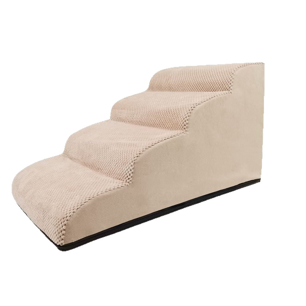 Beige two-step dog steps placed beside a sofa