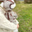 Warm padded dog coat and hat set with lead ring, showing size and shape