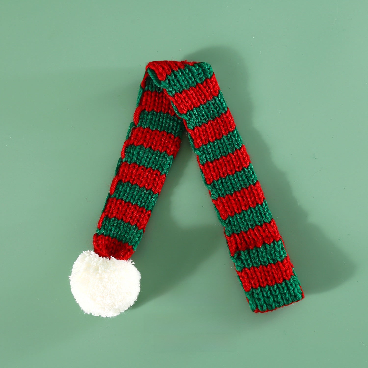 Knitted Christmas pet scarf with red and white festive stripes, view 8