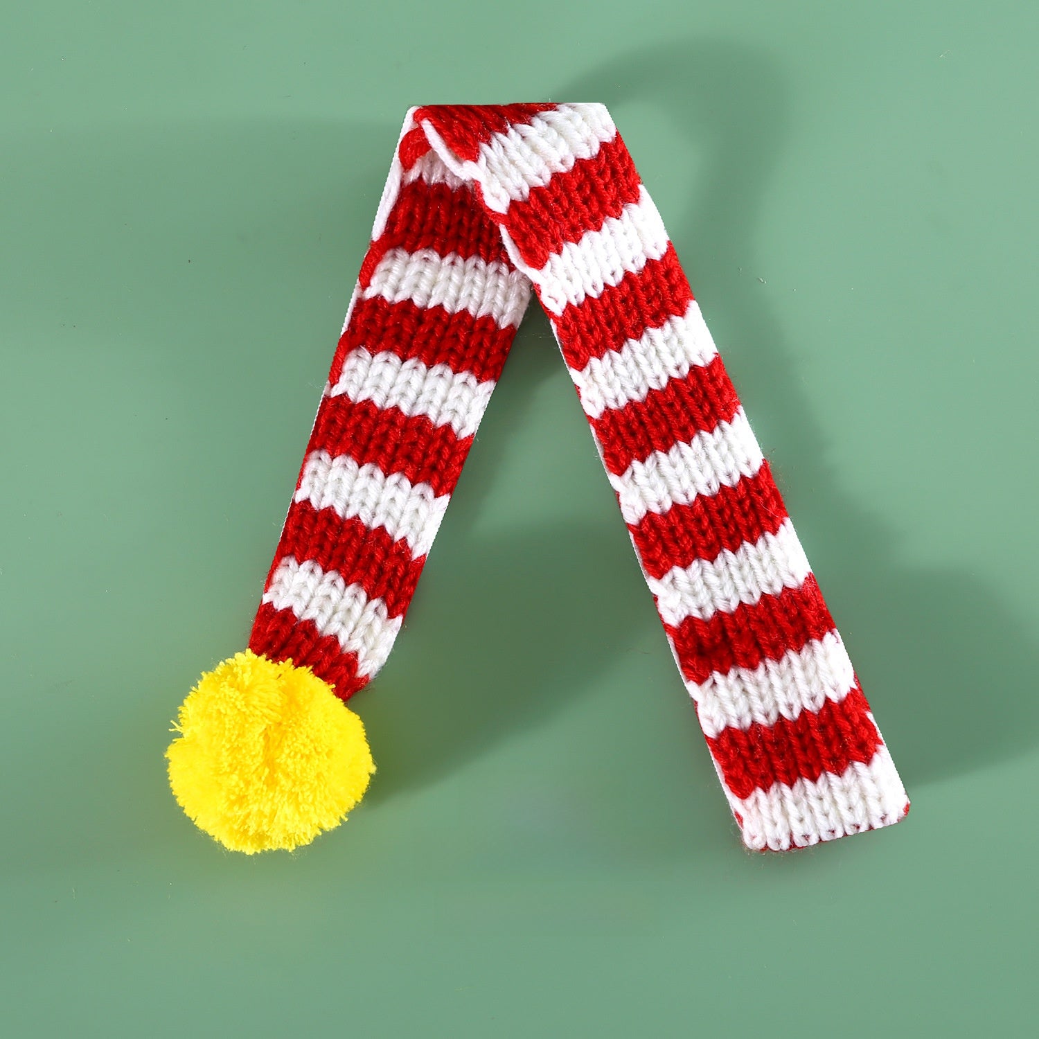 Knitted Christmas pet scarf with red and white festive stripes, view 6