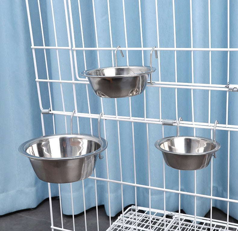 Pink spill-proof crate feeder clipped to a cage