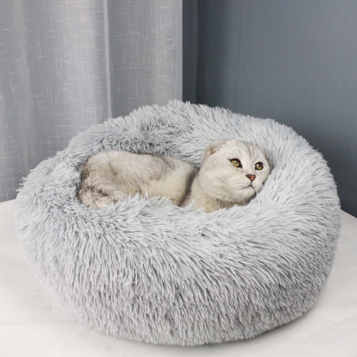Round velvet cat bed mat for winter, shown in 27 colours and styles