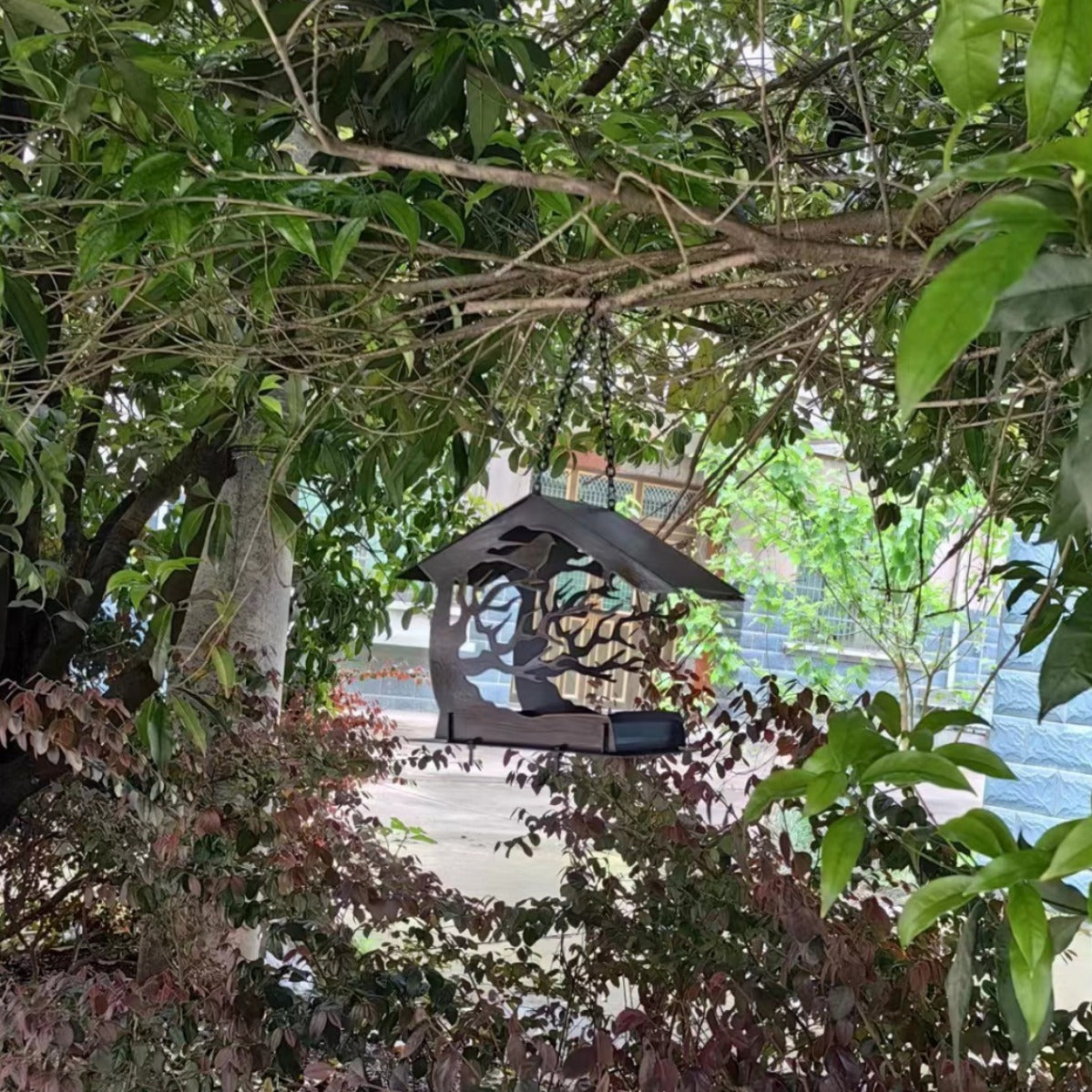Geometric metal hanging bird feeder for gardens, alternative angle view