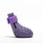 Small dog wearing bright silicone rain boots on a wet pavement