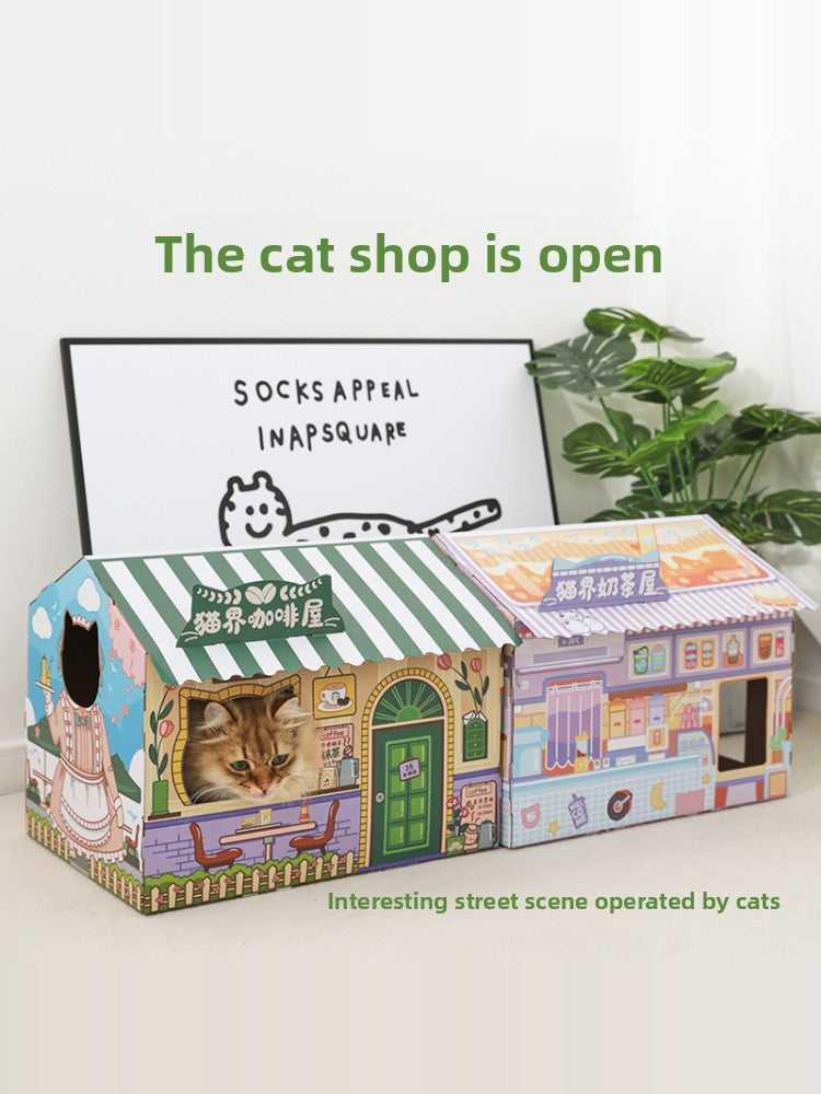 Cardboard cat scratcher house with a cafe themed design