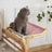 Window hanging cat bed with wooden frame and grey linen seat