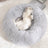 Light brown washable plush round pet bed with anti-slip base
