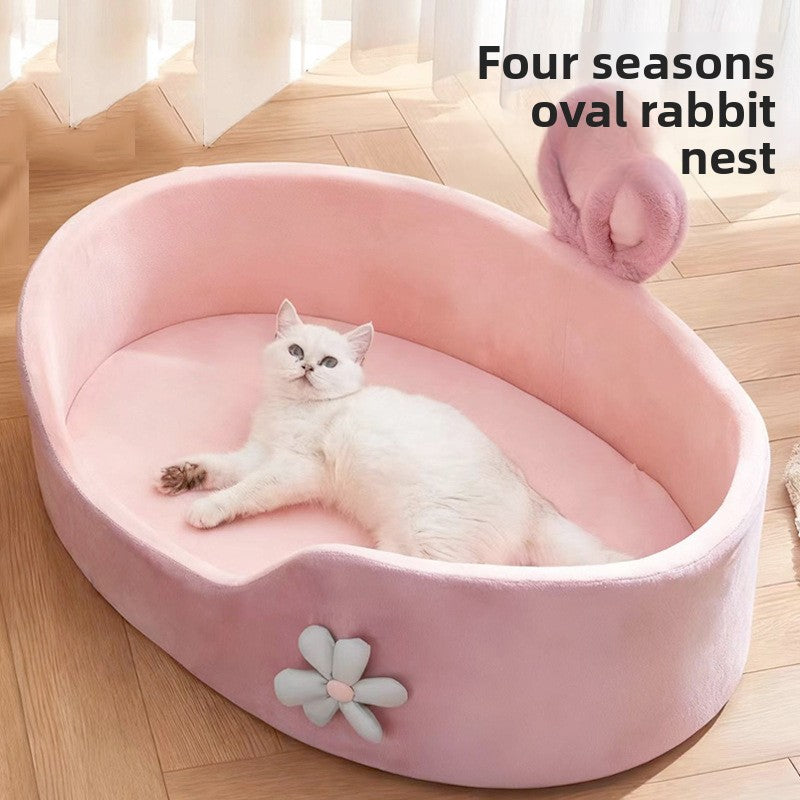 Pink soft sponge pet bed with raised edge, view 1