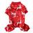 Coral fleece four-leg dog jumpsuit with holiday print, in use with a pet