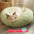 Round plush donut cat bed with raised rim, view 29