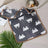 Small coral fleece pet mat in Dark Paw, product overview photo