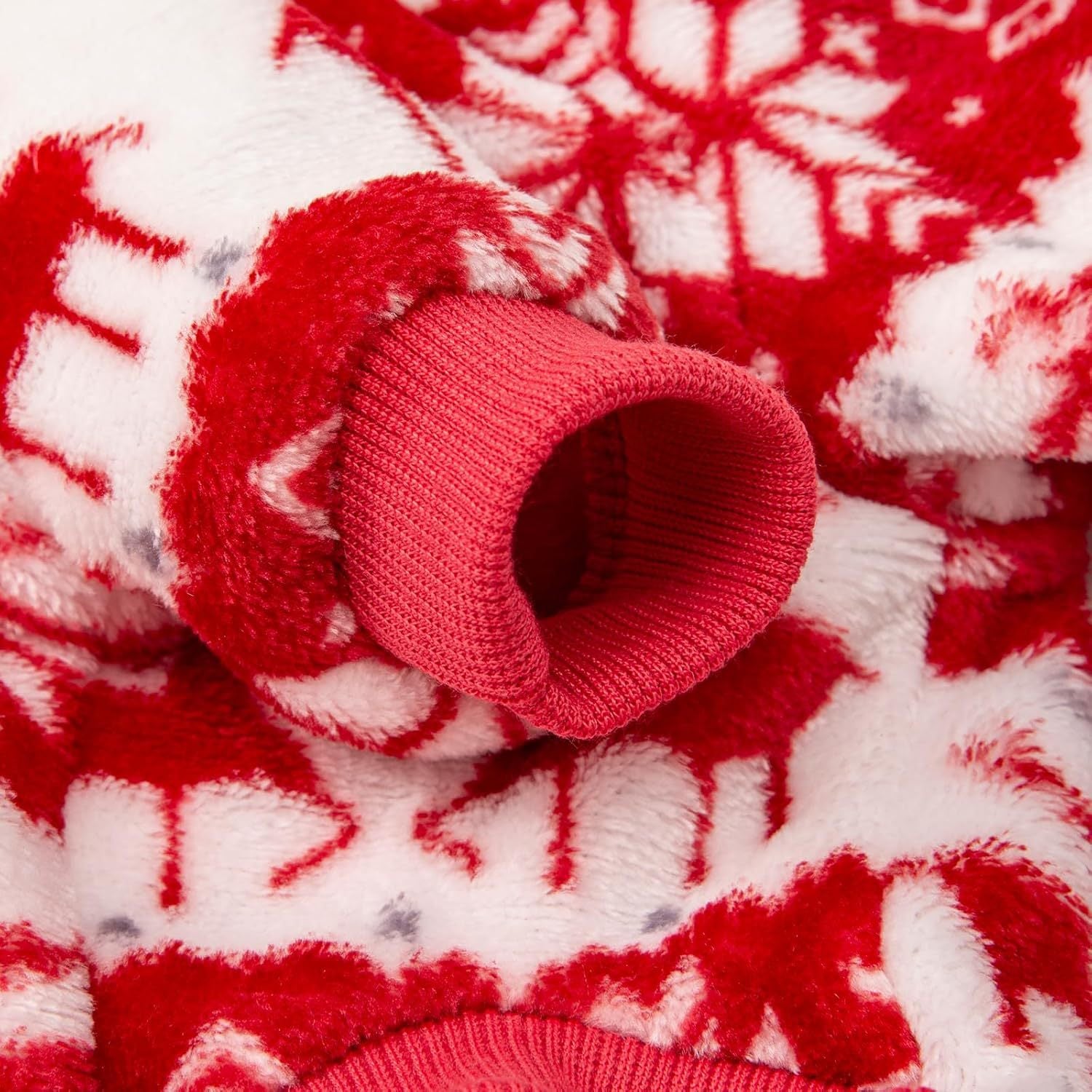 Coral velvet Christmas dog jumper with reindeer print in Red Deer, side view