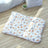 Cat sleeping on a pink rabbit coral fleece blanket