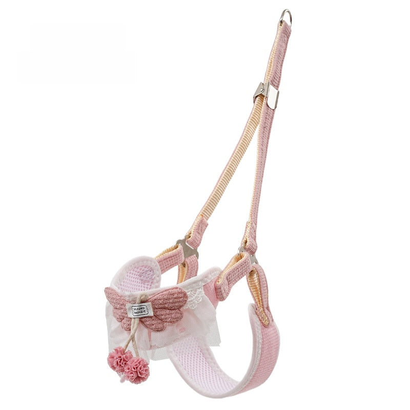 Floral vest harness and lead set in pink on a small dog